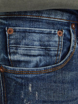 12194584 - Jeans Liam lavaggio sabbiato con rotture e vita bassa.