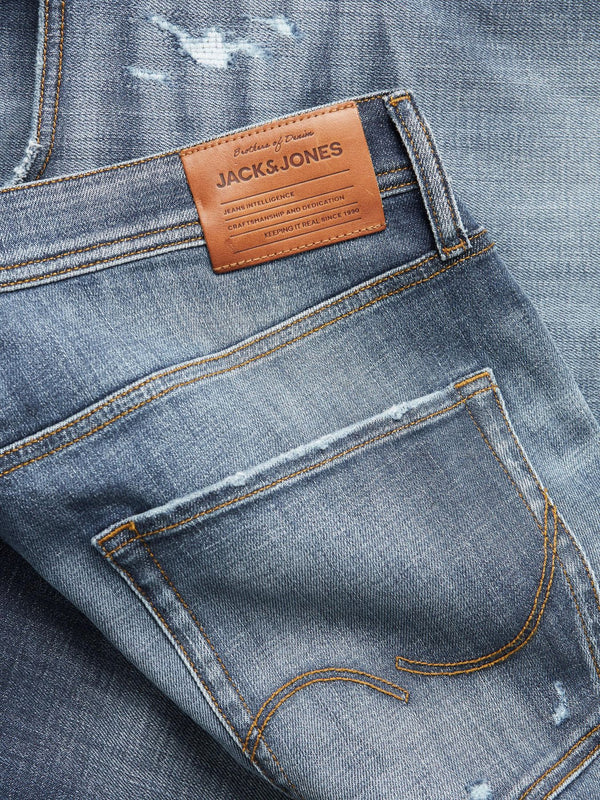 12244895 - Jeans cropped lavaggio scuro e sfumate alle gambe con cuciture a contrasto e piccole rotture, vita alta.